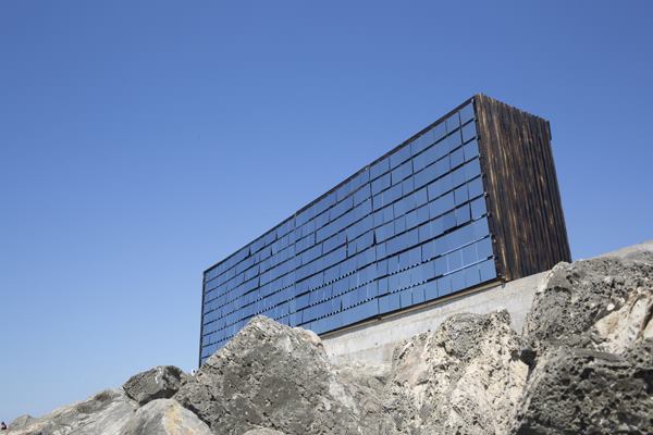 French firm NAS Architecture designed Breath Box's mirrored façade to respond to changes in the local environment.