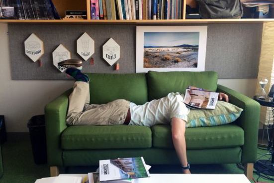 Associate design editor Deane Madsen, Assoc. AIA, tries to get comfortable on one of ARCHITECT's office couches.