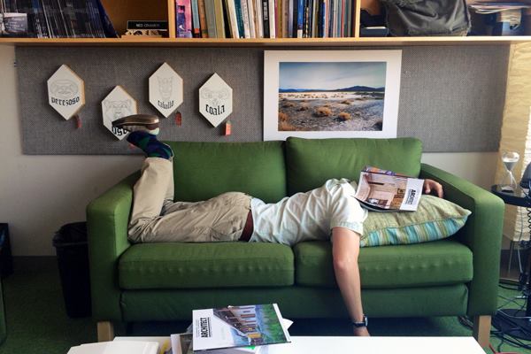 Associate design editor Deane Madsen, Assoc. AIA, tries to get comfortable on one of ARCHITECT's office couches.