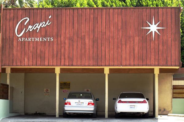 The dingbat is a typology common in Los Angeles, known for incorporating street-level semi-enclosed parking beneath dwelling units.