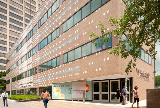 The+iconic+decoration+and+clipped+corner+entry+of+the+main+facade+were+preserved+and+repaired.