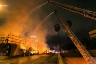 An under-construction, unoccupied apartment building in Los Angeles caught fire on Monday morning. According to the Los Angeles Times, officials report that the fire destroyed two-thirds of the 1.3 million square-foot structure, and harmed two nearby buildings.