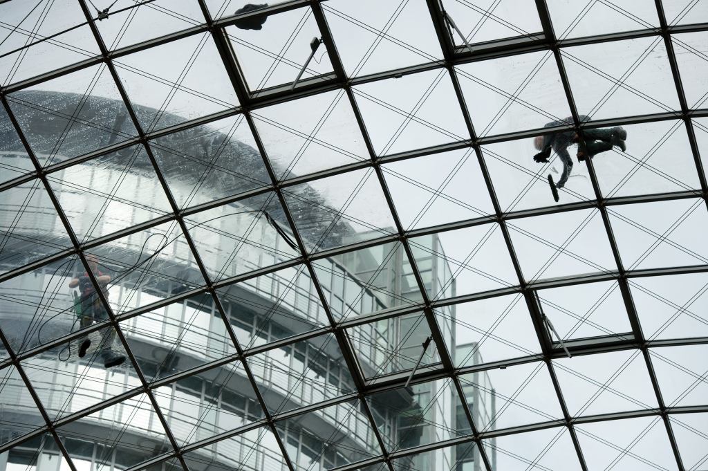 Window cleaner Michael Lehmann works on the roof of Dresden, Germany's World Trade Center.