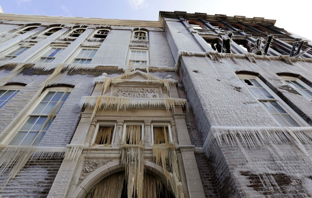The former James Mulligan Elementary School in Chicago is caked in ice, one day after a fire gutted the 114-year-old building. Developers had planned to convert the vacant historic building into condominiums.