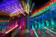 In this photo taken with a slow shutter, the Denver City and County building is illuminated by the traditional holiday light display. The holiday lights will burn each evening in Denver through New Year's Eve and then resume for the annual run of the National Western Stock Show and Rodeo.