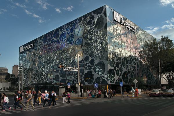 Rojkind Arquitectos transformed the Liverpool department store on Mexico City’s Avenida de los Insurgentes by wrapping three sides of the building in a 10-foot-deep layer of programmable hexagonal pods.
