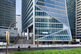 The tower has two entries, one at grade (pictured), and one on the plinth that defines the ground plane of the development at La Défense.