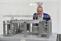 Hans Ulrich Obrist, curator of Switzerland's pavilion at the 2014 Venice Biennale, with a model of Cedric Price's Fun Palace.