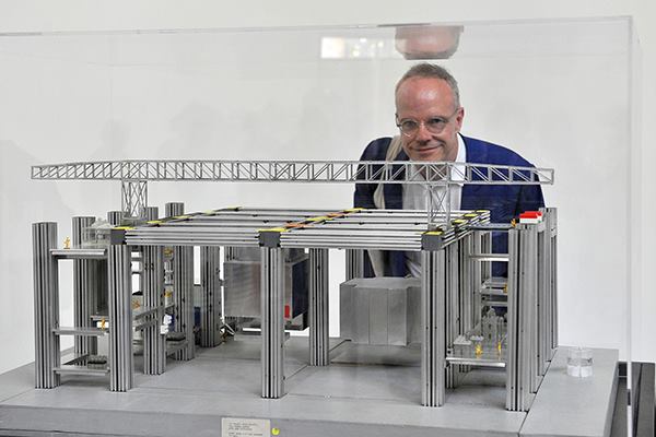 Hans Ulrich Obrist, curator of Switzerland's pavilion at the 2014 Venice Biennale, with a model of Cedric Price's Fun Palace.