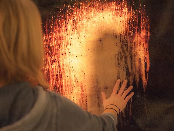 Students demonstrate a thermochromic textile panel that becomes translucent when wet. Project credit: Oleg Kozlovski, Christopher Massey, and Laura Moericke.