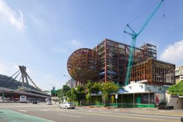 Construction on the Taipei Performing Arts Center in Taiwan, designed by OMA, tops out Wednesday.