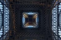 The renovation of the Eiffel Tower's first floor includes a glass floor along the inside perimeter, a feature that has become a crowd favorite.