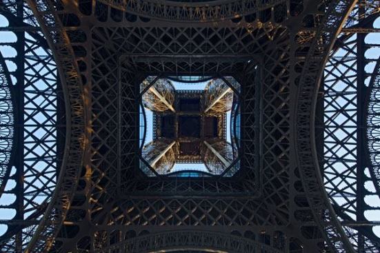 The renovation of the Eiffel Tower's first floor includes a glass floor along the inside perimeter, a feature that has become a crowd favorite.