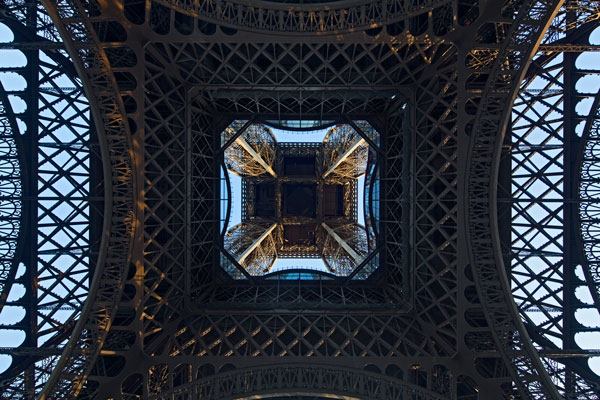 The renovation of the Eiffel Tower's first floor includes a glass floor along the inside perimeter, a feature that has become a crowd favorite.
