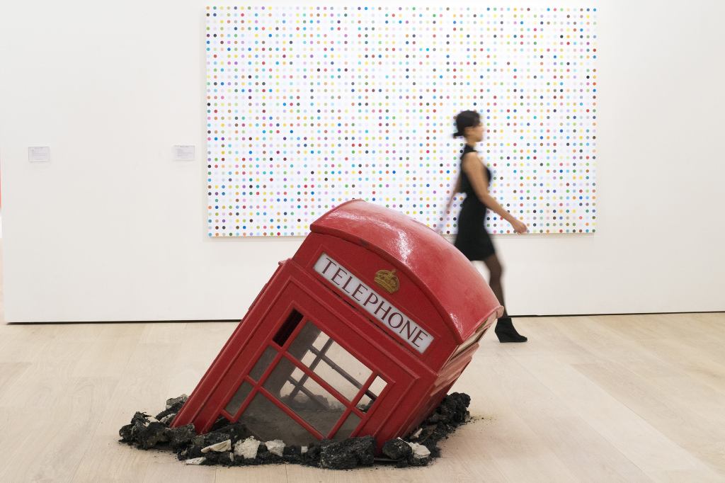 Artist Damien Hirst's "5-Fluorotryptamine" and Banksy's "Submerged Phone Booth" are on display at Phillips' new headquarters and exhibition space in London designed by architecture firm Aukett Fitzroy Robinson. The art auctioneer celebrated the opening of the new space with an inaugural public exhibition of contemporary sculpture curated by Francesco Bonami.