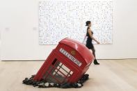 Artist Damien Hirst's "5-Fluorotryptamine" and Banksy's "Submerged Phone Booth" are on display at Phillips' new headquarters and exhibition space in London designed by architecture firm Aukett Fitzroy Robinson. The art auctioneer celebrated the opening of the new space with an inaugural public exhibition of contemporary sculpture curated by Francesco Bonami.