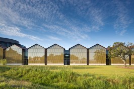 Exterior+view+of+the+College+of+Business+as+seen+from+the+campus+illustrating+the+ceramic+fritted+glass+pavilions