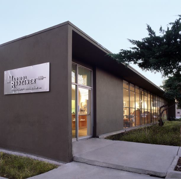 A flat-roofed volume fronts the industrial shed that houses the Marmol Radziner workspace.