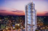 Taichung Condominium Tower stands among a blend of low- and high-rise buildings in the urban city.