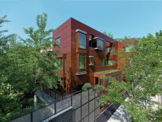 Each floor features bay windows from Dynamic Architectural Windows & Doors.