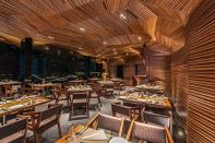 Workers sanded and coated the 3,000-square-foot wood surface with a melamine-based polish, a popular wood finish in India. It took an 18-person carpentry crew three months to complete the work.