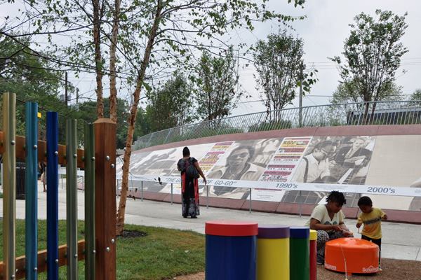 Chimes and drums allow youngsters to practice percussion at the edge of the memorial.