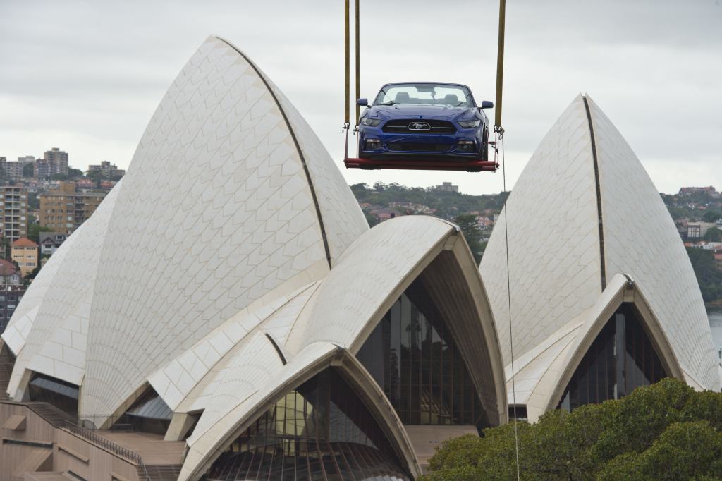 Launched skyward in the early hours of the morning by crane, this GT convertible Mustang ascended a Sydney high-rise building next to the Opera House and Sydney Harbour Bridge to prepare for a breathtaking view of one of the world's most iconic New Year's Eve events. This caps a history-making year in which the Mustang also scaled the Empire State Building and Burj Khalifa, the world's tallest skyscraper in Dubai, to celebrate the iconic pony car's 50th Anniversary.