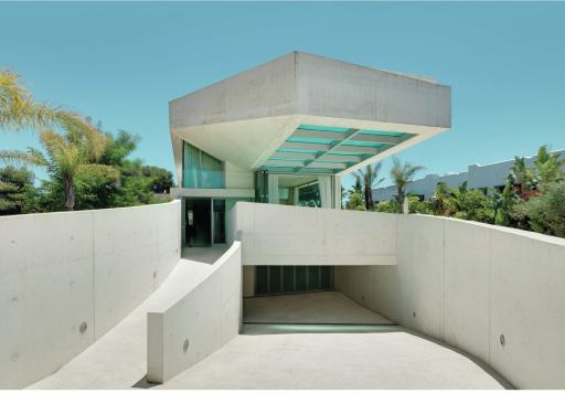 A rooftop pool cantilevers 9 meters (29.5 feet) over the entrance to the Jellyfish House.