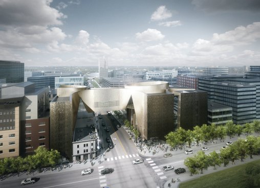 View from the south, showing an overview of the building’s structure, including a bridge that spans both a city street and the restored King Edward Hotel.