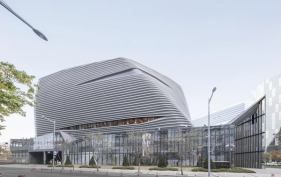 The+first+floor+is+a+transparent+base+that+invites+people+in%3b+the+upper+levels+house+showrooms+and+are+largely+windowless.