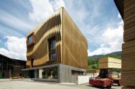 MoDus Architects won Damiani-Holz & Ko’s invited design competition to create a new headquarters in Bressanone, Italy, with a concept that embodies the company’s timber construction capabilities and showcases wood’s potential as a building material inside and out.