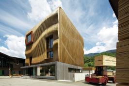 MoDus Architects won Damiani-Holz & Ko’s invited design competition to create a new headquarters in Bressanone, Italy, with a concept that embodies the company’s timber construction capabilities and showcases wood’s potential as a building material inside and out.