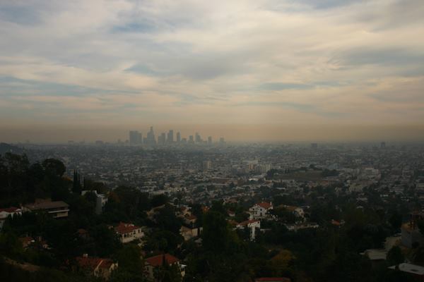 The present-day Los Angeles skyline beneath a film of smog.