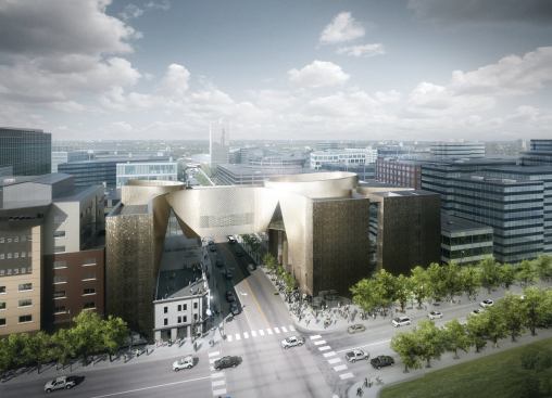 View from the south, showing an overview of the building’s structure, including a bridge that spans both a city street and the restored King Edward Hotel.