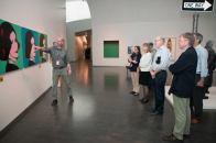 Lighting designer Clint Paugh shows museum staff how the museum's different artworks look under LED lighting.
