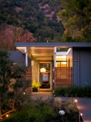 The fin-style fence reduces but doesn't block visibility between inside the house and outside.