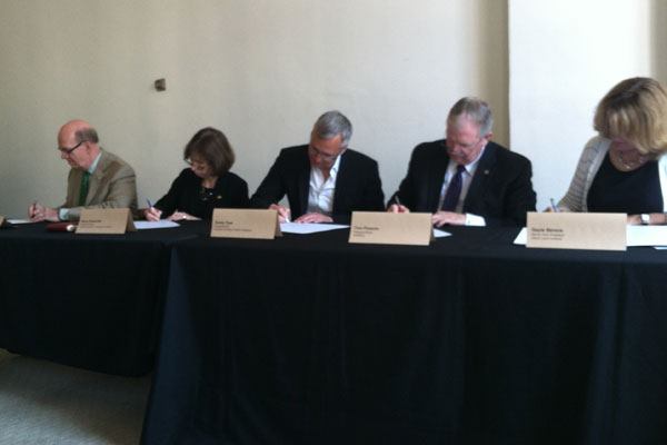 Robert Ivy, FAIA, CEO of the American Institute of Architects; Nancy Somerville, executive vice president and CEO of the American Society of Landscape Architects; Randy Fiser, executive vice president of the American Society of Interior Designers; Tom Phoenix, president-elect of ASHRAE, and Gayle Berens, senior vice president of the Urban Land Institute sign a joint industry statement on resilience at the National Building Museum in Washington, D.C. on May 13, 2014.
