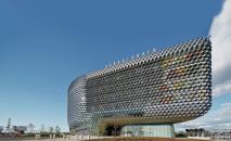 Behind the metal-and-glass west face of the new SAHMRI complex in Adelaide, Australia, brightly painted and enclosed support spaces add visual punch and reduce heat gain.