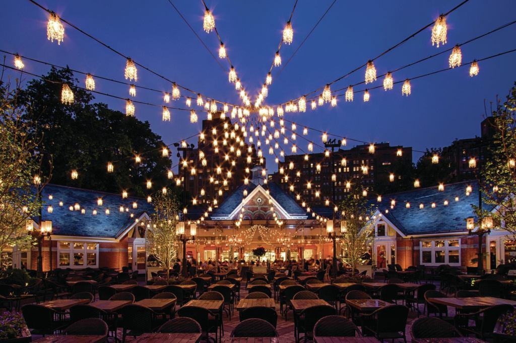 The new courtyard lighting, a series of miniature chandeliers strung to mimic the silhouette of a circus tent’s roof, creates a canopy of light against the sky every bit as effective and evocative as the illuminated trees that once were there.