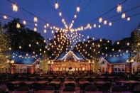 The new courtyard lighting, a series of miniature chandeliers strung to mimic the silhouette of a circus tent’s roof, creates a canopy of light against the sky every bit as effective and evocative as the illuminated trees that once were there.