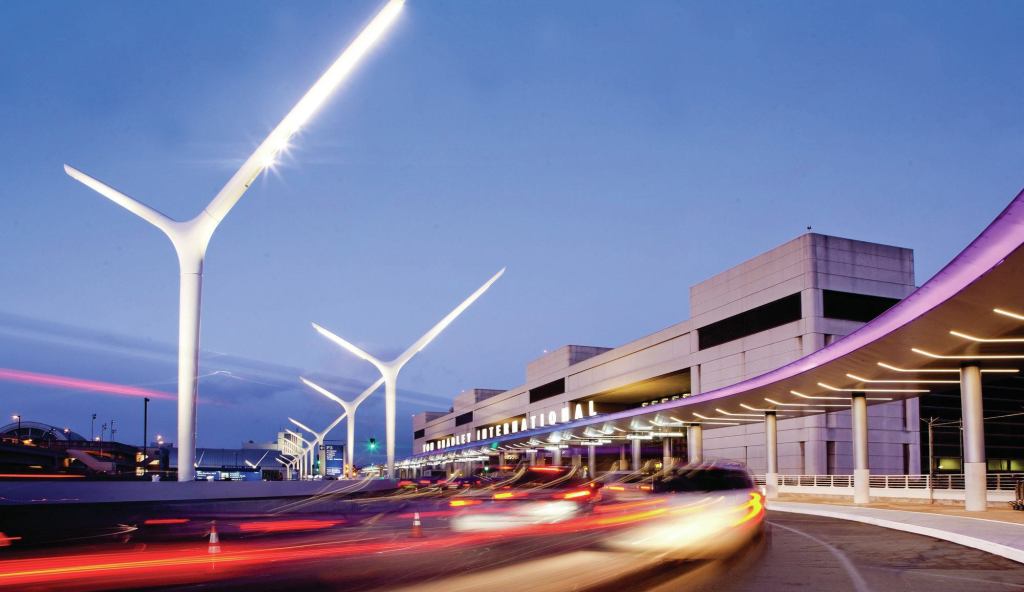 The approach to Tom Bradley International Terminal with the new lighting improvements, which feature a series of sculptural roadway light poles and a new, illuminated entrance canopy.