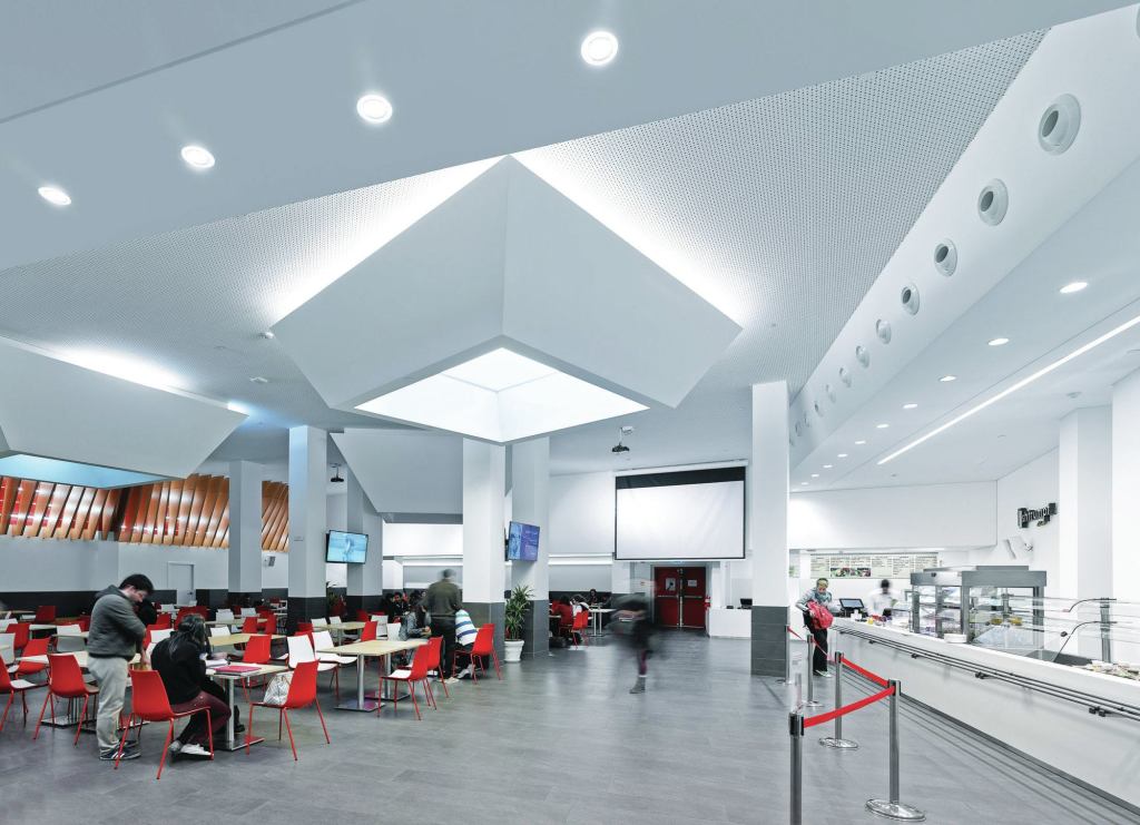 The illuminated light-wells in the cafeteria are set to 2700K in the morning to create a more relaxing environment and quality of light for students.