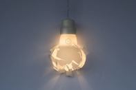 Swedish studio Gässling achieved the look of shattered glass by 3D printing the diffuser of its Wreaking Ball lamp.