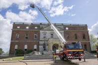 Fire officers at the Clandon Park House, in Guildford, Britain. Designed by the Venetian architect Giacomo Leoni, the 18th-century Palladian mansion was gutted by a huge fire on Wednesday afternoon.