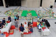 LEGO makers build a 30-by-50-foot map of the United States at the National Maker Faire at the University of the District of Columbia.