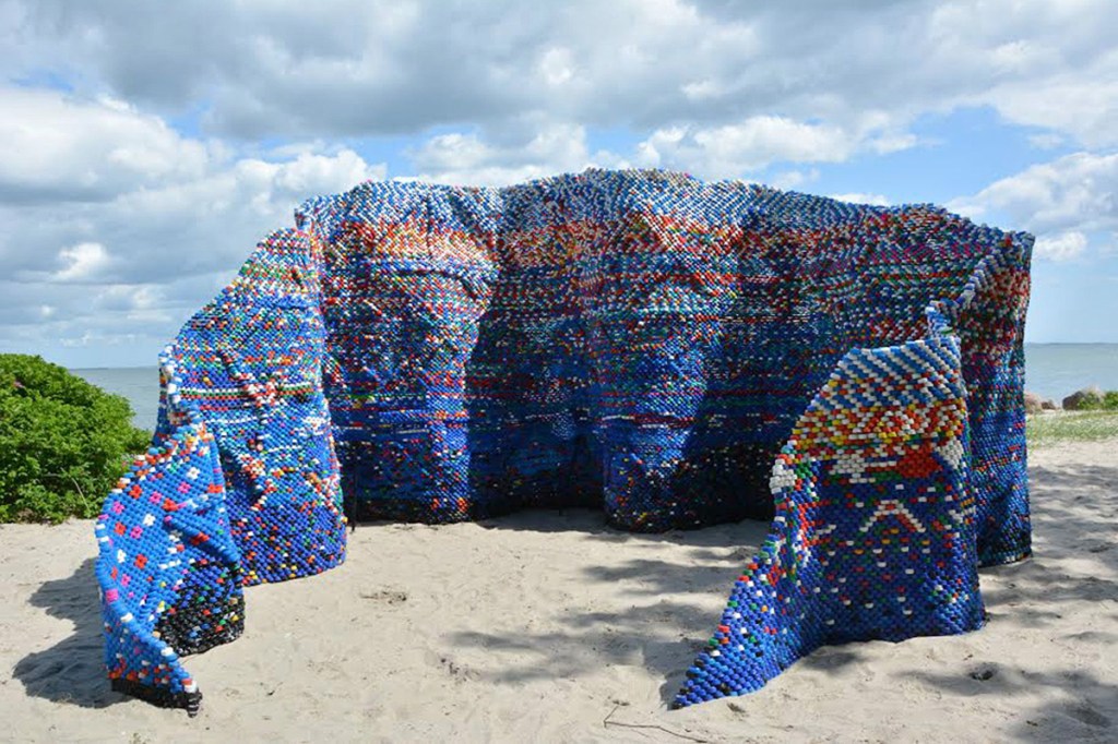 Artist Arunkumar H G created the installation "Droppings and the Dam(n)" out of more than 70,000 bottle caps collected over a year to comment on how disposable and wasteful lifestyles create unhealthy environments. Sited in Aarhus, Denmark, the artwork is part of the "Sculpture by the Sea" exhibition.