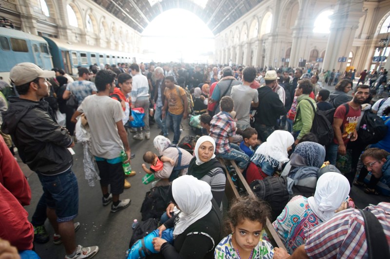 Migrants  wait inside the Keleti Railway Station in Budapest, Hungary. Migrants are now allowed to enter the station but direct trains from Budapest to Western Europe are currently out of operation until further notice.