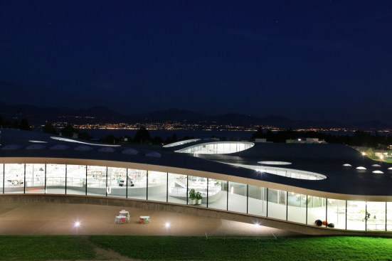 Rolex Learning Center, EPFL, Lausanne, Switzerland. Exterior view by night