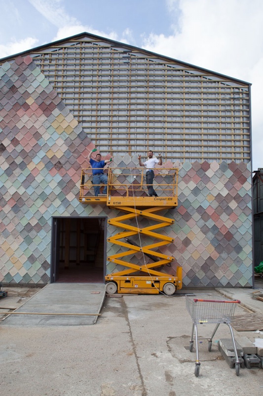 Two Assemble members pose outside of Yardhouse, an affordable workspace building they carried out in Stratford.
