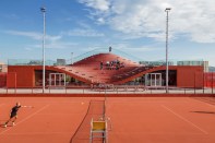 The southern façade, which features seating that overlooks the clay tennis courts.